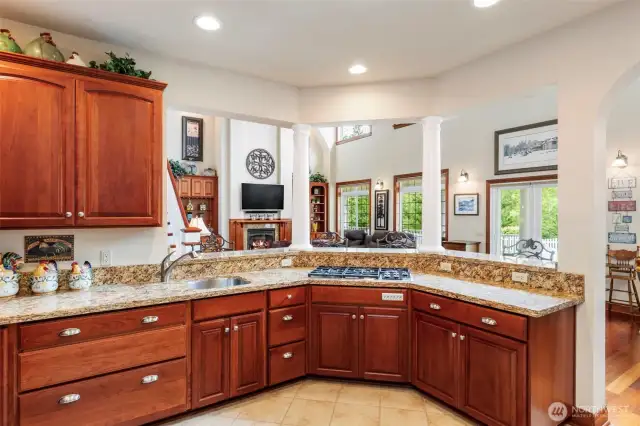 Kitchen has granite countertops, gas stovetop and loads of storage, cabinet space and counter space. Flexibility of entertainment style with your guests.