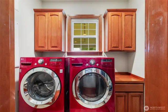 Laundry room included newer washer and dryer set.