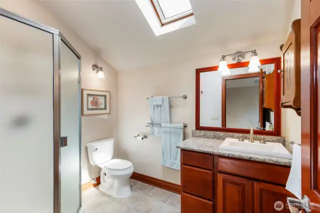 Bonus room/guest suite enjoys a private 3/4 bath with a skylight.
