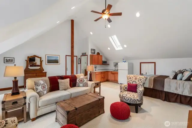 Upstairs mother in law apt enjoys vaulted ceilings, mini kitchen, private 3/4 bath and loads of storage in attic areas.