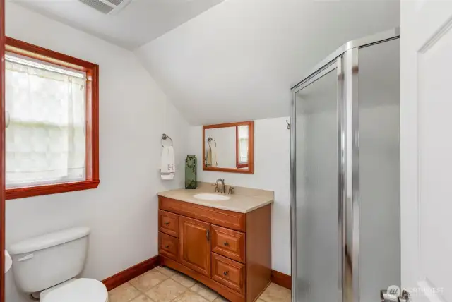 Upstairs mother in law apt enjoys vaulted ceilings, mini kitchen, private 3/4 bath and loads of storage in attic areas.