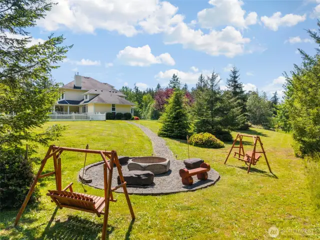 Custom fire pit area with Olympic Mountain views.