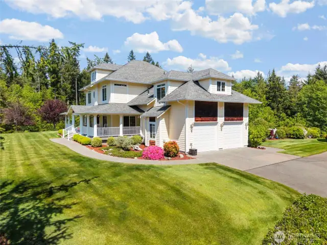 Large covered front porch and attached high pocket two car garage.