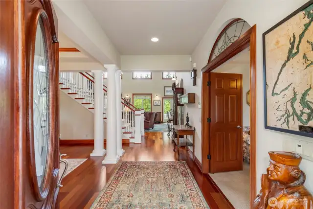 Entry foyer flows to the formal dining room and den and great room.