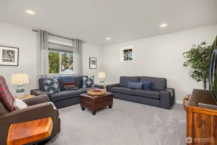A spacious family room welcomes you to the 2nd floor