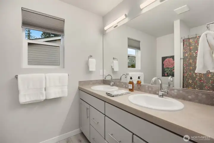 The second floor bathroom provides a shower/tub combination for households desiring both.
