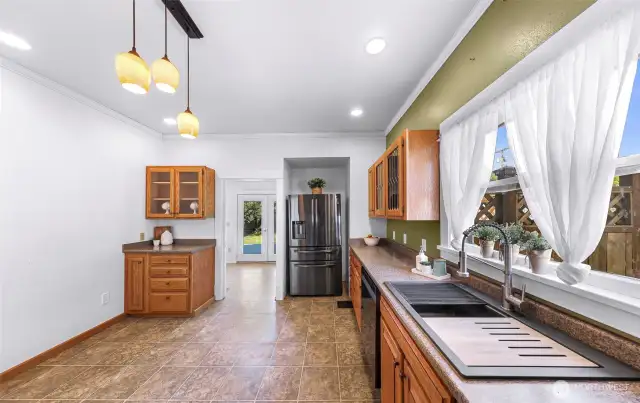 Kitchen flows through to the laundry room