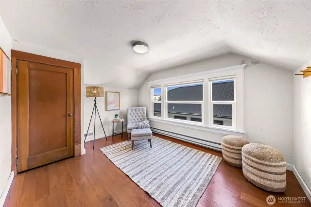 Third bedroom located upstairs with character filled ceiling angles.