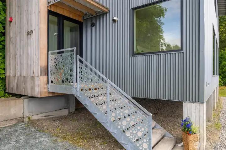 The entry railing was custom designed by the architect and fabricated locally