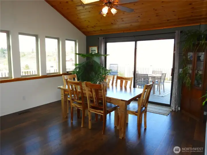 Large dining room connecting to wraparound deck.