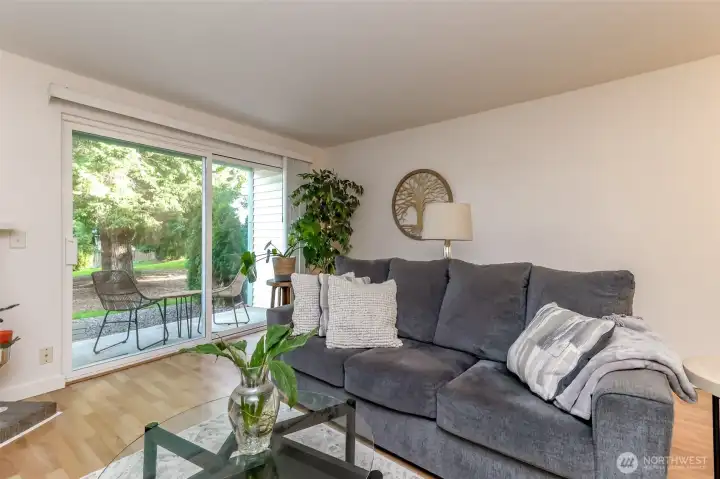 Large slider door steps out to a charming sitting patio, perfect to sip your morning coffee, afternoon tea or your favorite evening beverage.