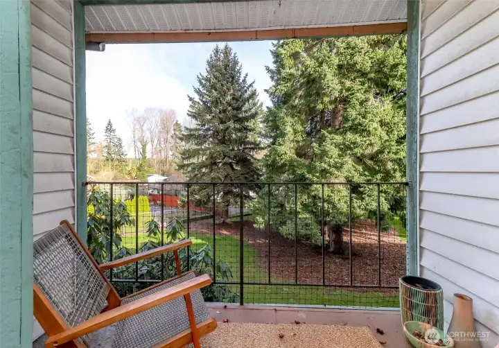 Peaceful and serene views from upper-level balcony off the primary bedroom.