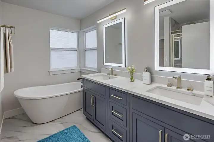 Designer 5-piece ensuite with a freestanding tub and a huge walk-in closet