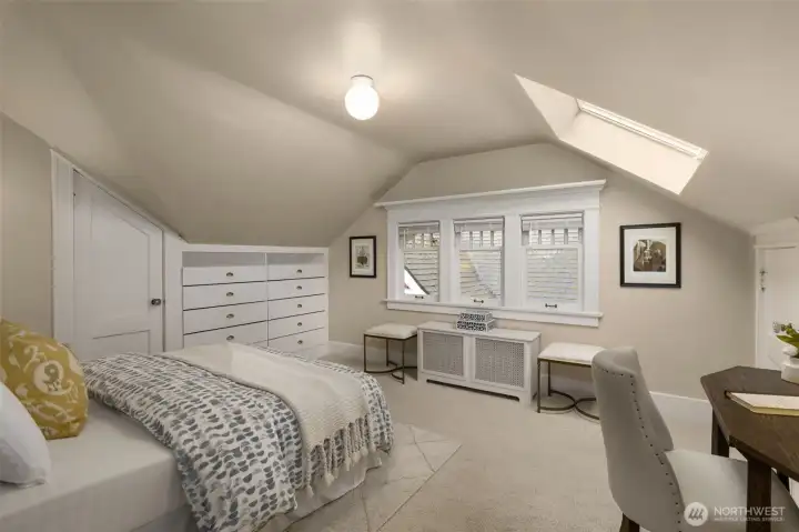 Upstairs bedroom 2 with skylight.