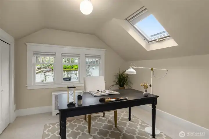 Upstairs bedroom 4. We have staged this as an office but there is room for a queen bed here.