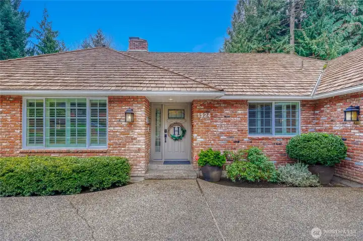 Front view of home. Well maintained brick siding & wood siding