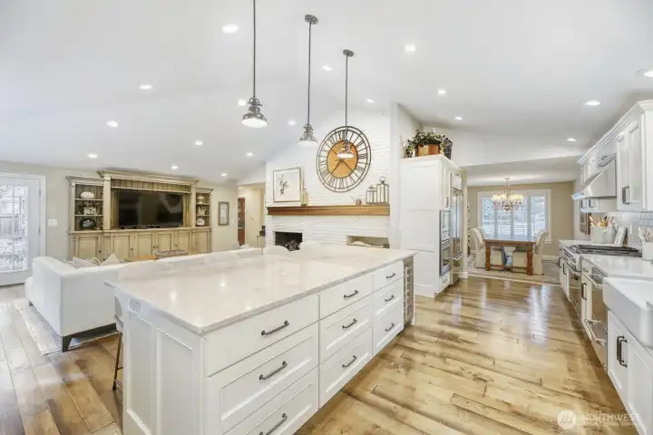 View of kitchen towards dining room.  Notice the extra large island with cabinets for storage.  All cabinets have solt close doors.