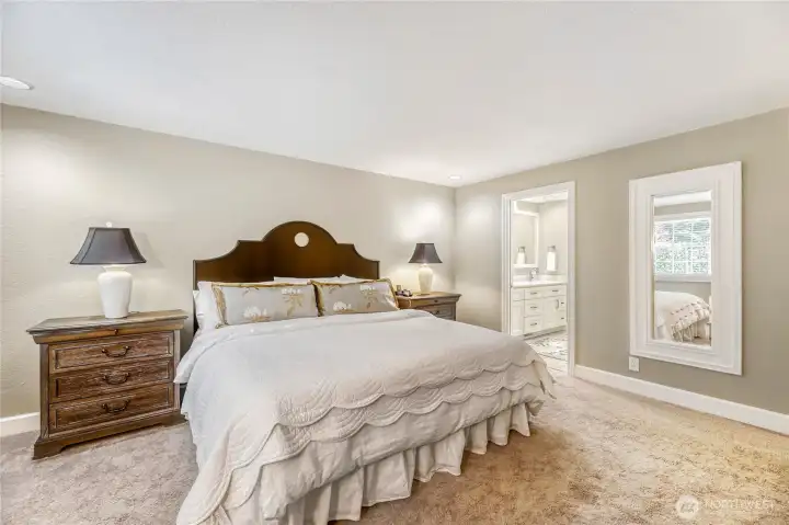On suite master bedroom view towards the bathroom.  Large mirror goes with seller