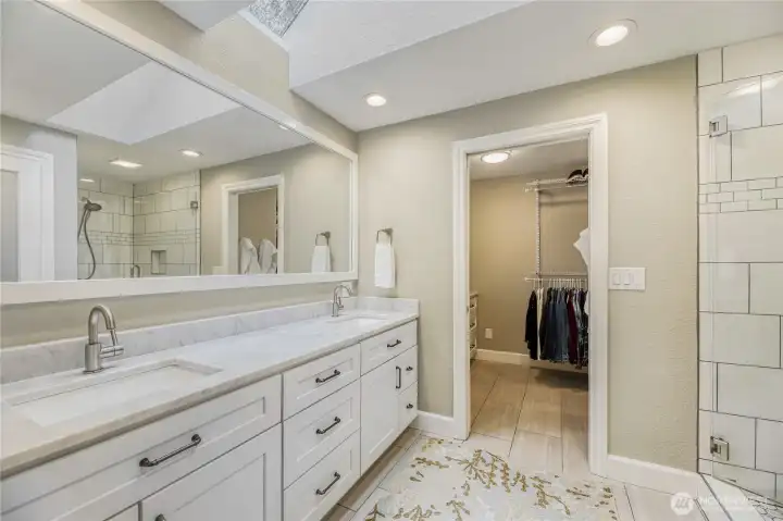 Master bathroom has marble counter tops, toilet area has privacy door and toto toilet.
