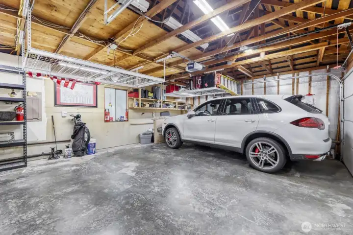 Garage has storage in attic area and additional wire rack storage.