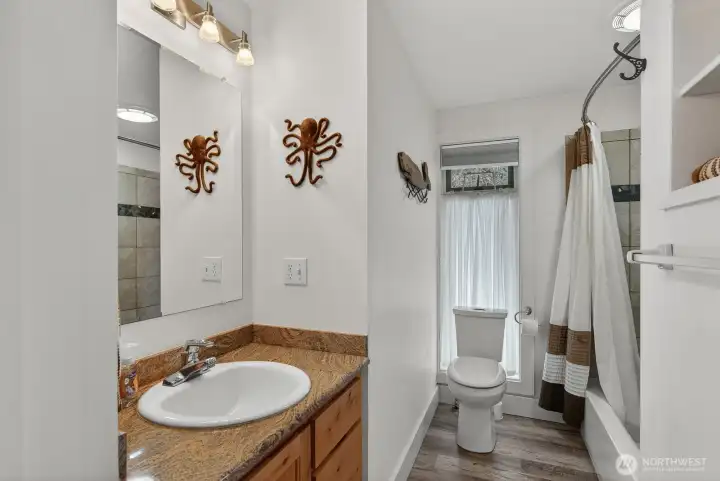 Full guest bath with tub/shower & built ins or extra storage.