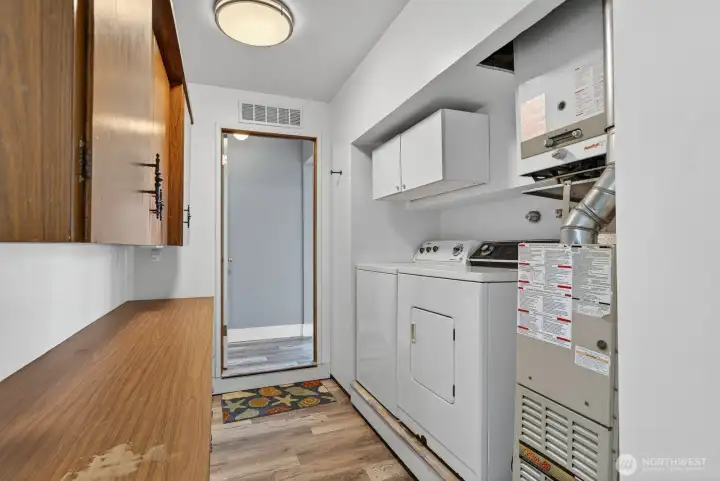 Utility room is in a little storage area that is perfect for tools, pantry, Etc.