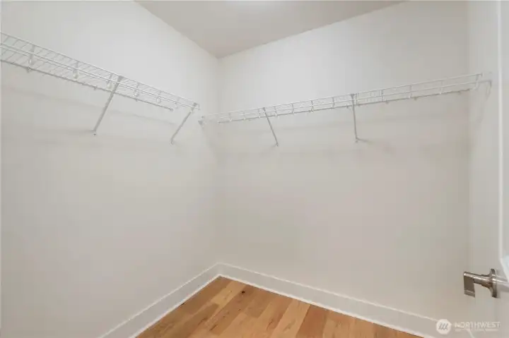 The primary suite includes two separate walk-in closets positioned directly across from each other