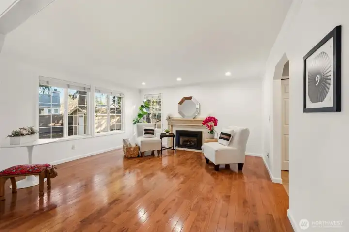 Stunning wood floors extend through the main living areas, adding warmth, durability, and timeless character to the home.