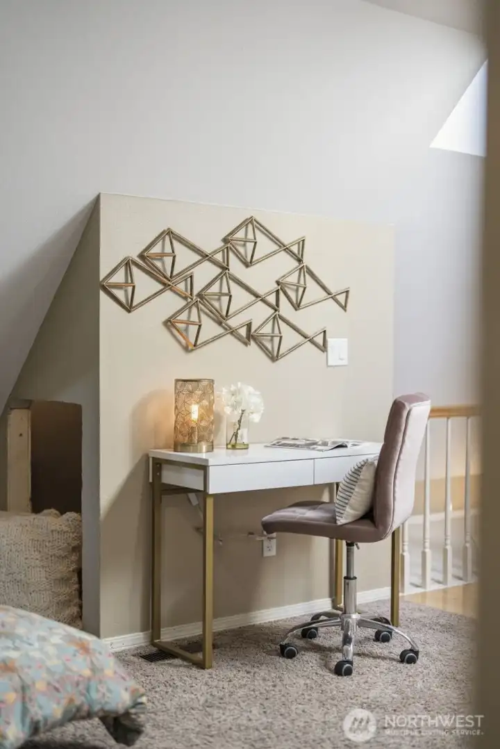 An ideal work-from-home setup, the loft workspace overlooks the secondary living room and keeps you connected while working in comfort.