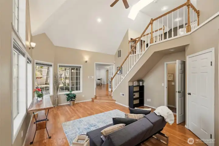 French doors open to a versatile secondary living area that can serve as a quiet retreat, media room, or extended living space.