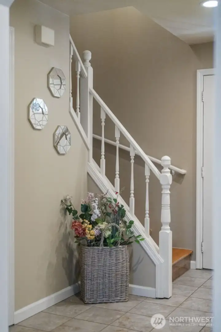 The stairs off the main entrance lead to the upper level where you will see 3 bedrooms and 2 bathrooms.