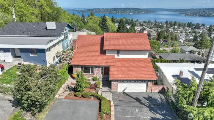 Ample parking with garage and extended driveway