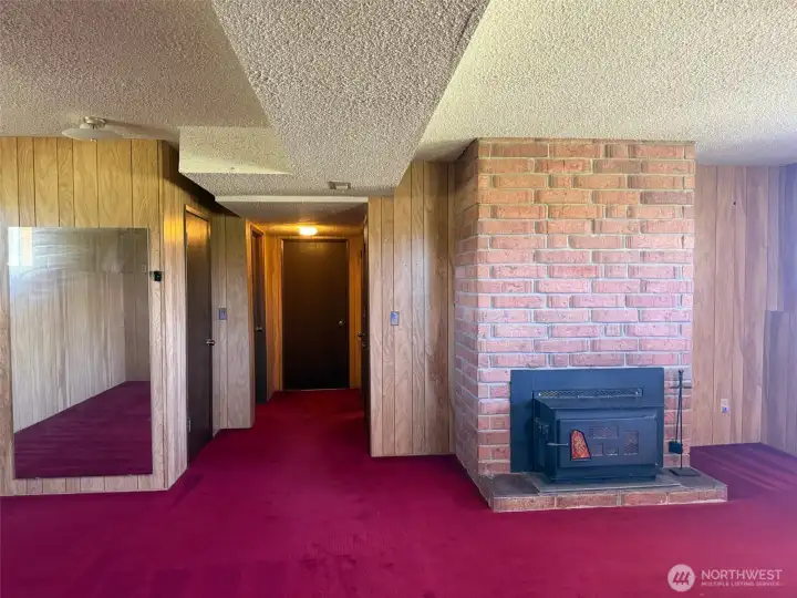 Lower level family room fireplace and hallway