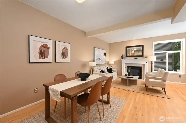 This open-concept space is anchored by a gas fireplace surrounded by a wooden mantle and 9' high ceilings.