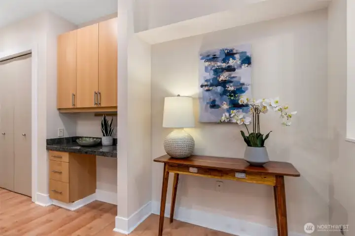 Double door to left of desk/workspace is a floor-to-ceiling fully shelved pantry. Double door to left of desk/workspace is a floor-to-ceiling fully shelved pantry.