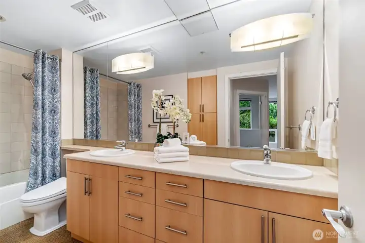 Double-vanity bathroom with heated bidet toilet. Double-vanity bathroom with heated bidet toilet.