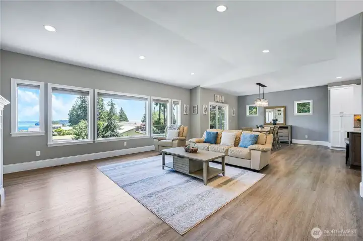 Entering the home you are greeted with beautiful great room, with large windows to enjoy the wonderful sound, city and island views.