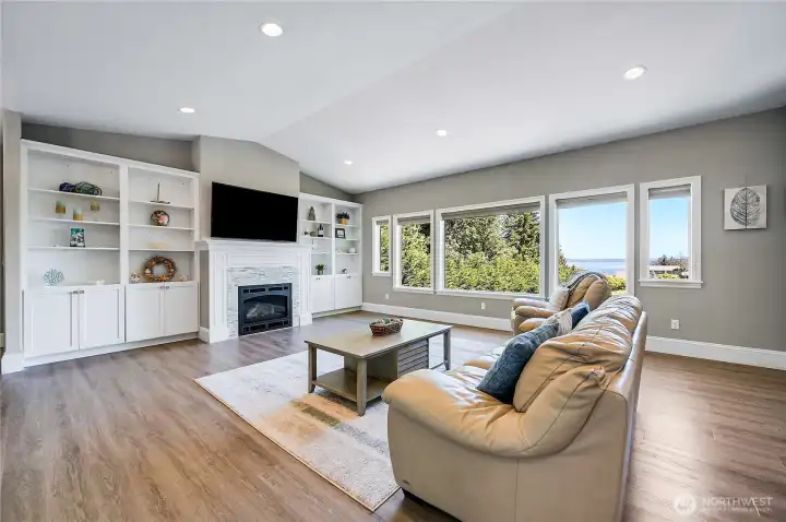 You have to love the built-in cabinets with a gas fireplace makes this a charming focal point. You can see the nice Puget Sound views out the windows.