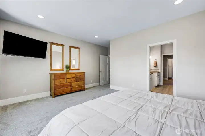 The spacious primary has plenty of space to accommodate the largest of bedroom sets.