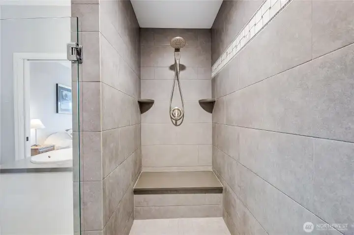 One side of the shower with built in seating.