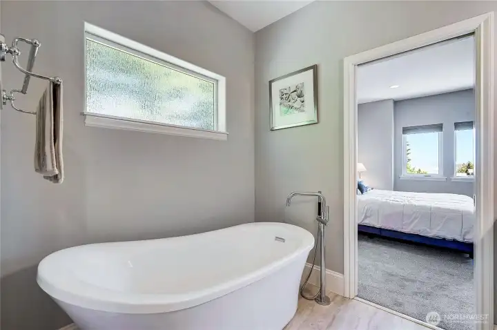 The eggshell tub is a wonderful place to unwind after a hard day.