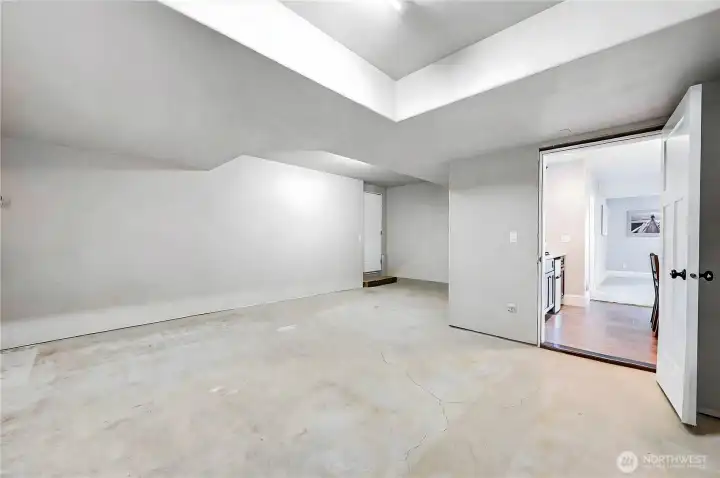 This semi-finished room just needs flooring, or leave it as is and make a workshop.