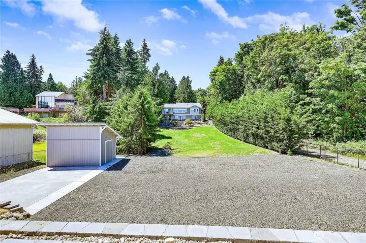 All this is yours, plenty room here to store all of your big toys, that is a nice storage shed or workshop on the left and the entire .86 acre lot is fully fenced. This home has eveything any buyer would love to have.