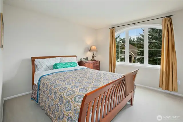 Guest suite on upper level has full ensuite bath.