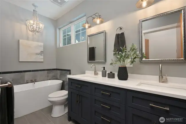 Full bath on the top floor has heated floors, dual sinks and separate soaking tub.