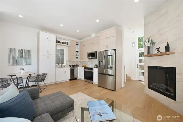 Nice open space with fireplace on the kitchen/living/dining room floor.