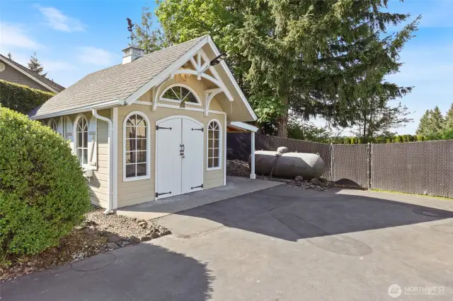 Large Shed with concrete floor and 500 gallon propane tank.