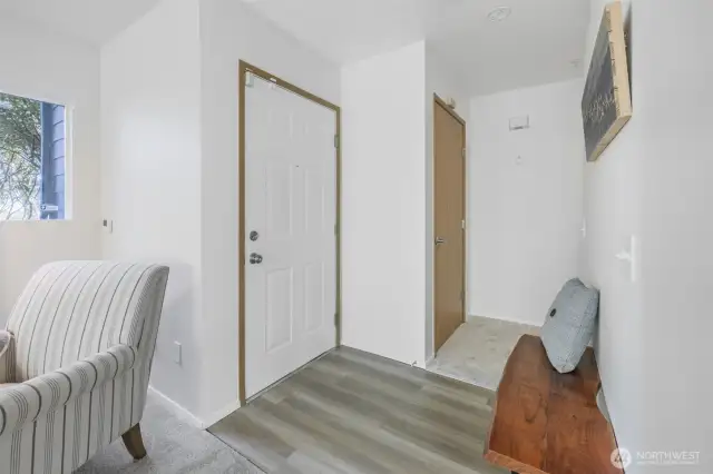 Looking back toward front door with coat closet to the right.