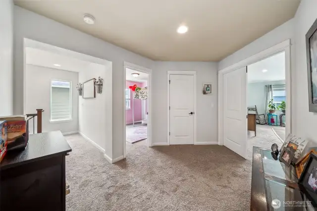 Open landing at top of staircase doesn't  cramp this area into a small hallway.
