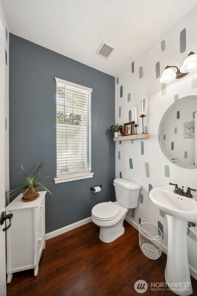 1/2 bathroom located just off the foyer on  main level.